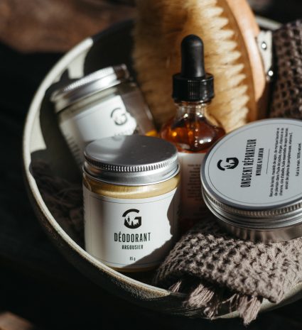 Jar of sea buckthorn deodorant in a basket with personal care products