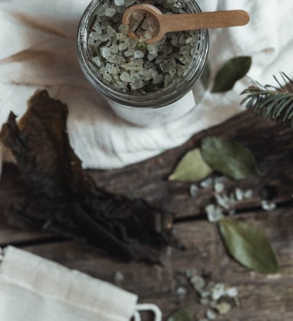 Conifer and seaweed bath salts in an open jar