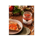 Jar of wild crabapple jelly with toast on a wooden table